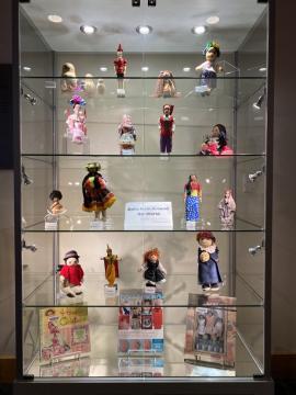 Photograph of Dolls Around the World exhibit with 16 different countries represented. Collection of Anita S.