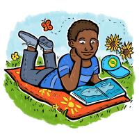 Boy laying on his stomach in the grass reading a book.