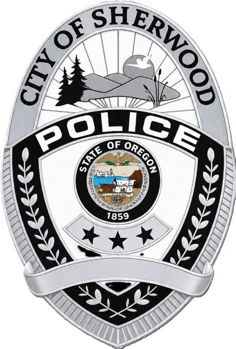 Badge for the City of Sherwood Police Department, featuring the State of Oregon seal, laurel branches, and landscape illustrations.