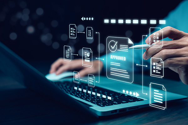 Person using a laptop with digital icons of documents and an 