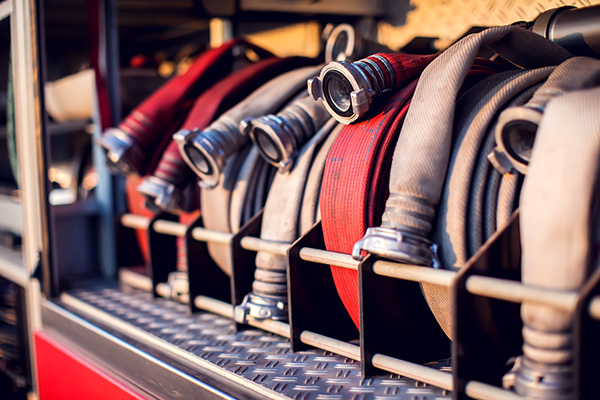 Fire hoses on the back of a truck