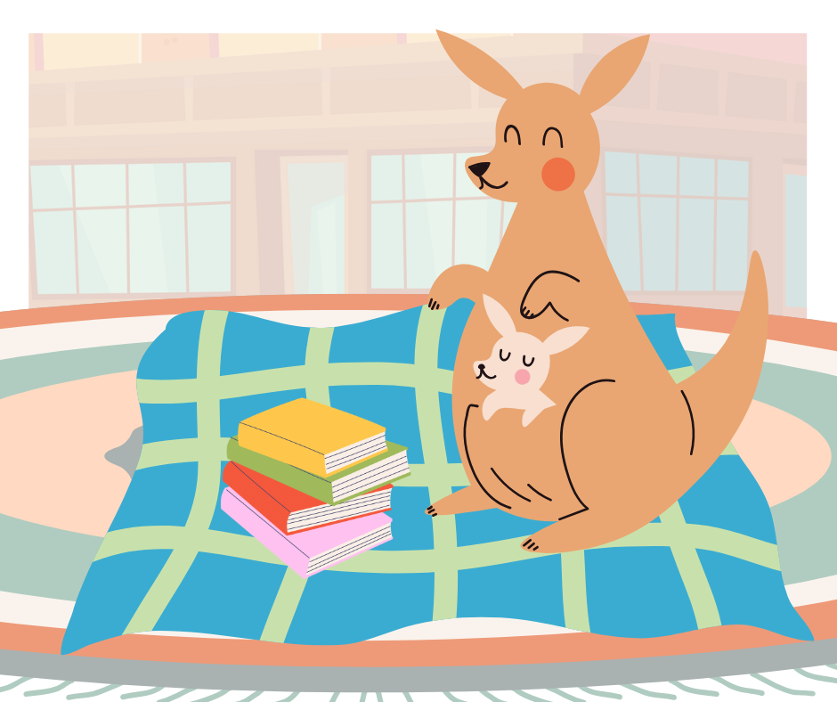 A kangaroo with a joey in its pouch sits on a blanket next to a stack of colorful books.
