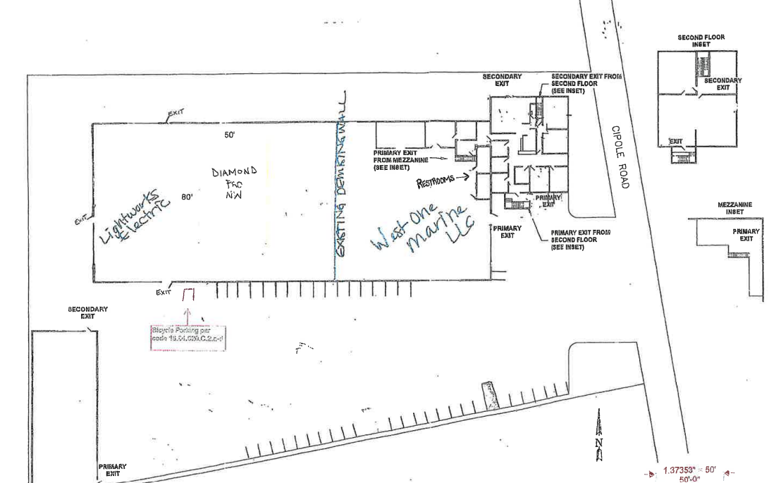 Building floor plan with labeled exits, parking spaces, and handwritten notes indicating areas for lights and Wi-Fi; includes rooms and corridors on the right.