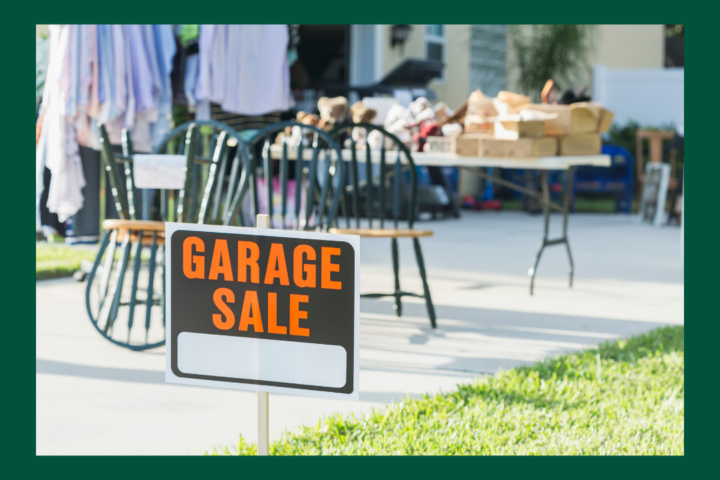 A garage sale sign is displayed on a lawn with items and tables in the background; City of Sherwood, Oregon logo appears at the top.
