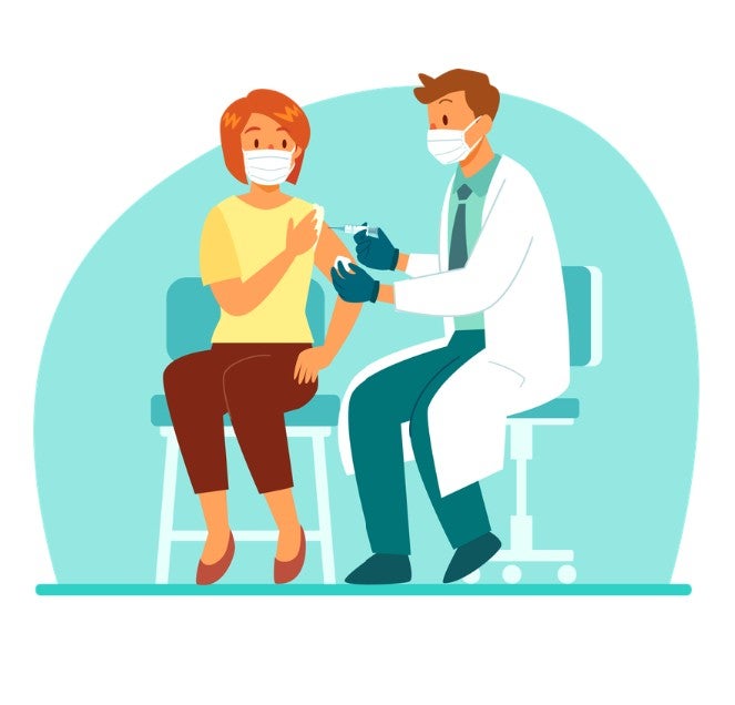 A healthcare worker wearing a white coat and mask gives a vaccination shot to a seated woman in a mask. Both are in a clinical setting with teal and white colors.