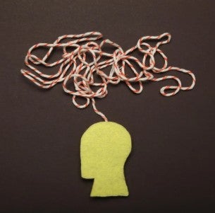 A yellow silhouette of a human head with a tangled red and white string emerging from the top.